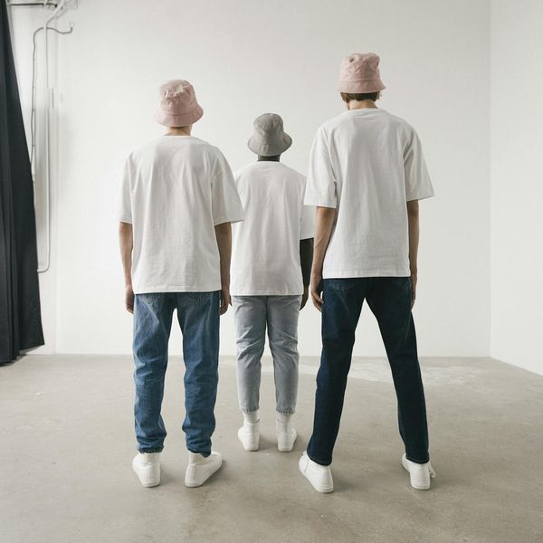 Group of diverse people meditating in a bright, modern studio.